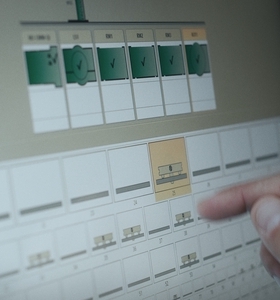 Operator working on EROWA JMS process control system with touchscreen